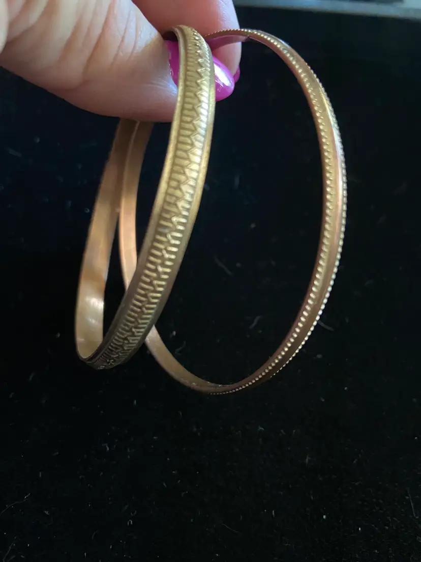 2 Unverified Metal Bracelets Resembling Copper