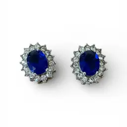 Princess Diana-inspired blue sapphire and clear cubic zirconia stud earrings.