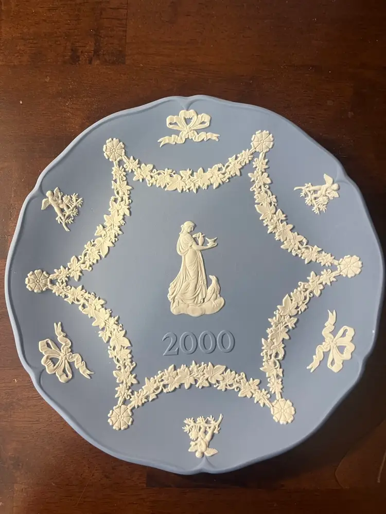 A blue Wedgwood Jasperware collector plate from 2002. 7” In Box