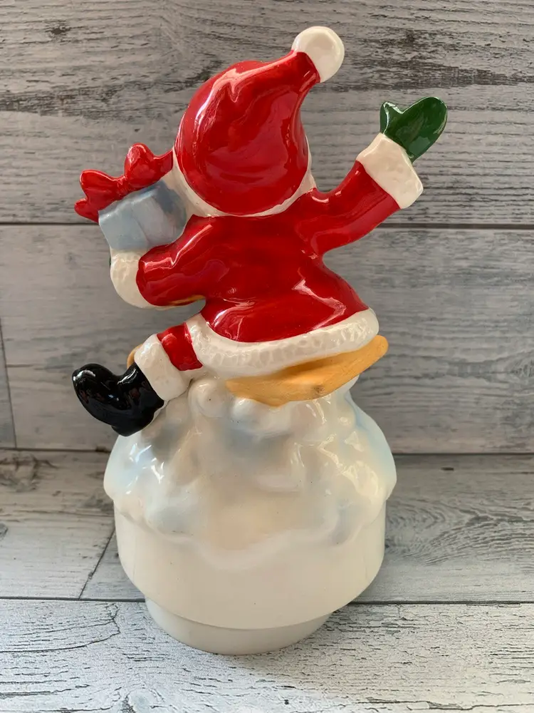 Santa Claus Sledding Christmas 
Musical Figurine