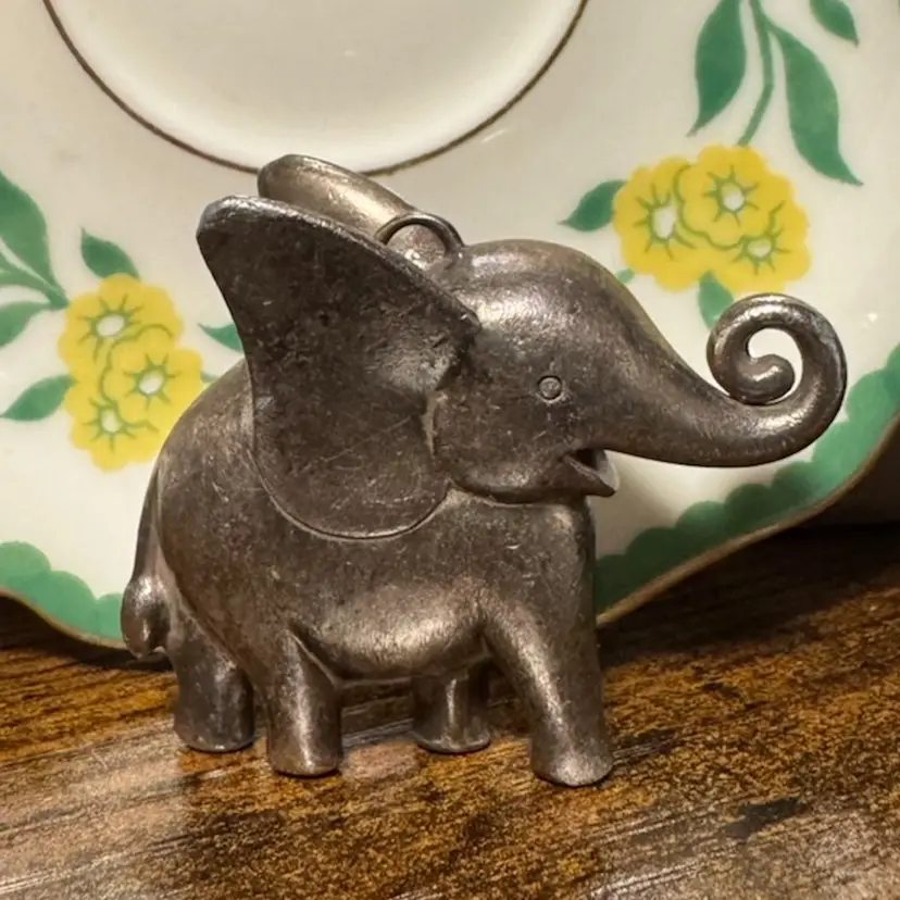 vintage 1” wide 1.5” tall pewter Dumbo elephant figurine and pendant