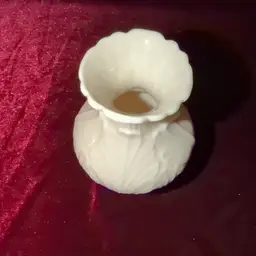 Lenox Elfin Collection bud vase in ivory porcelain with a leaf pattern and 24K gold trim.