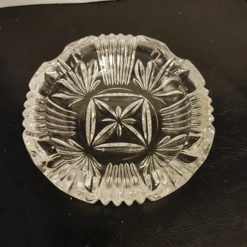 Glass ash tray. 4.25 diameter. No chips or cracks. Can also be used as a trinket dish.