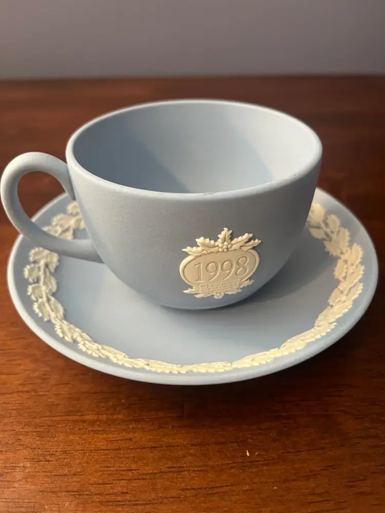 Set Of Wedgwood blue Jasperware commemorative teacup and saucer set.
Both in boxes excellent condition