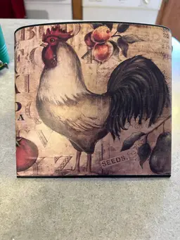 Metal wall pocket with rooster print by Kimberly Poloson.
