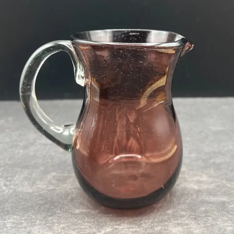 #232B Vintage Hand Blown Open Creamer Pitcher In a Smokey-Purple Color With a Clear Applied Handle. Not Signed