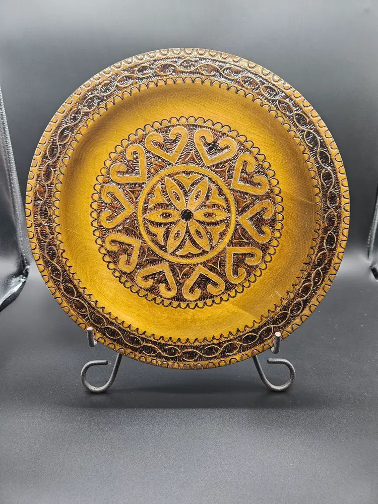 This vintage hand-turned carved wood art plate from Poland is a unique piece of folk art that showcases the intricate craftsmanship and artistic flair of Polish artisans. Measuring 11 inches in diameter, this handmade plate features detailed carving and smoothing, making it a charming addition to any collection of European cultures and ethnicities.  It is pre-owned and has been very gently used. There is little to no wear/  PLEASE review the images carefully and feel free to reach out if you have any questions or would like any other pictures!  Be aware that most of our items are vintage or antique and may have small defects or signs of age. We do our best to provide the best items possible. Also, we do light cleaning on all our items. If we find any defects, we do our best to identify them in the description.   If there is an issue with your purchase for any reason, please reach out to us and we will be happy to take care of it for you.  Also, we would love it if you would Follow, Like and/or Share, our items and/or our store page!