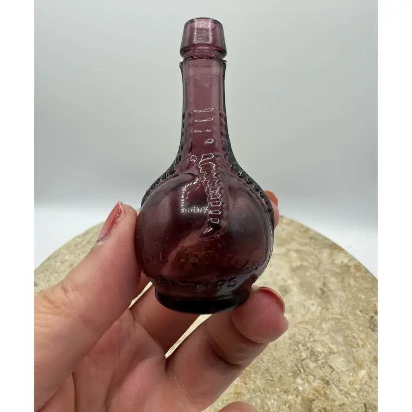 Vintage Miniature "Ball and Claw Bitters" Glass Bottle Marked Made In Taiwan UV Glow
