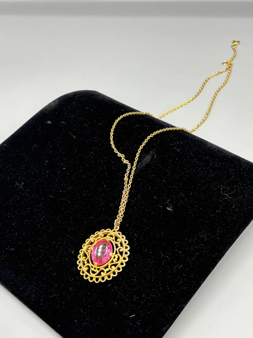 Gold tone chain pink pendant