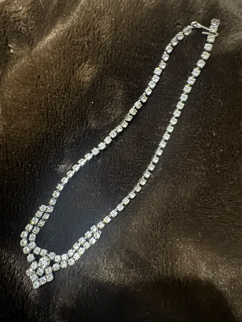 Vintage-style rhinestone necklace is a silver-toned choker with a double-band design