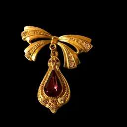 Brand 1928 Gold Tone Brooch With A  Redish Pink Rhinestone Dropping Down From A Bow With Clear Rhinestones