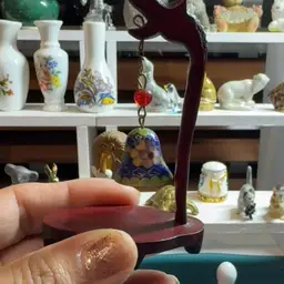 Closionne Bell On Wood Stand