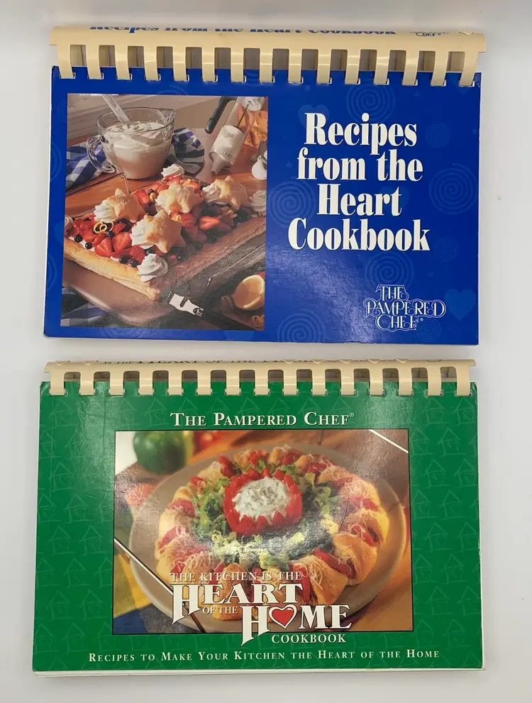 2 Pampered Chef Cookbooks. “Recipes from the Heart”1997.  “ Kitchen Is The Heart Of The Home.” 1999