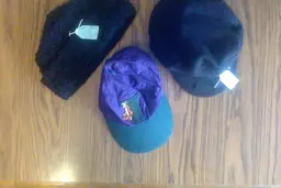 Vintage Hats: Black Shearling, Black Greek Fisherman's Cap, Purple Tigger Ball Cap.  $8each.