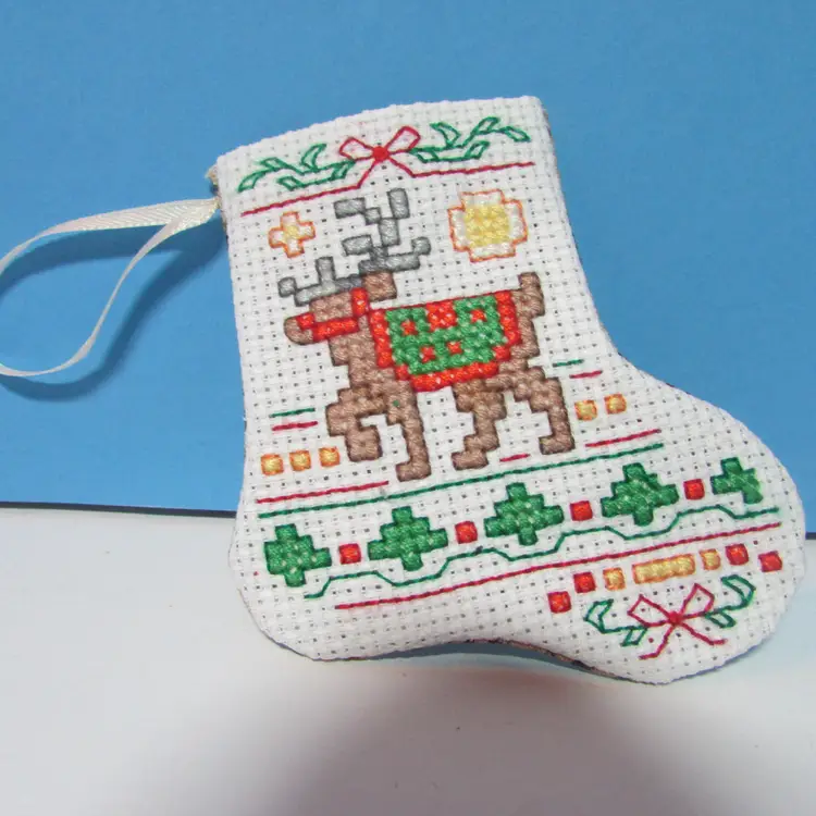 completed handmade cross stitch small Christmas stocking ornament reindeer