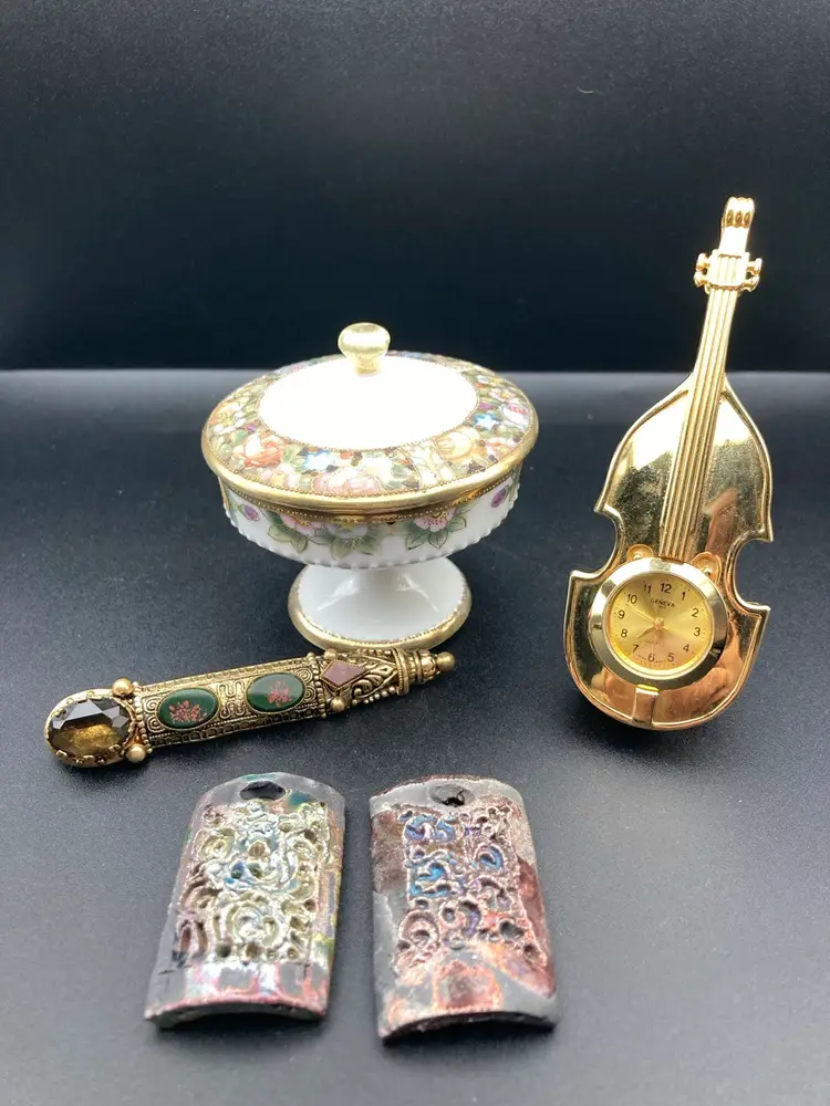 Elegant Evening Vignette! Vintage Bar Brooch Gold Tone And Glass (3 1/4” Long 1” Wide) Vintage Handpainted Nippon Miniature Compote With Lid (3” Tall 2 1/2” Diameter READ 1 Tiny Chip On Inside Of Lid) Miniature Clock Geneva Boy Quartz Japan Movement (4” Tall 1 1/4” Wide READ Needs A Battery UNTESTED Face Falls Out Easily) 2 Raku Pottery Pendants (1 3/4” x 1”)