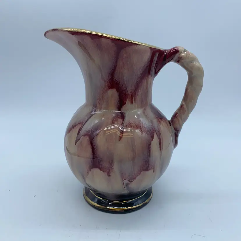 #2227 Vintage West German ceramic pitcher with drip glaze and braided handle.