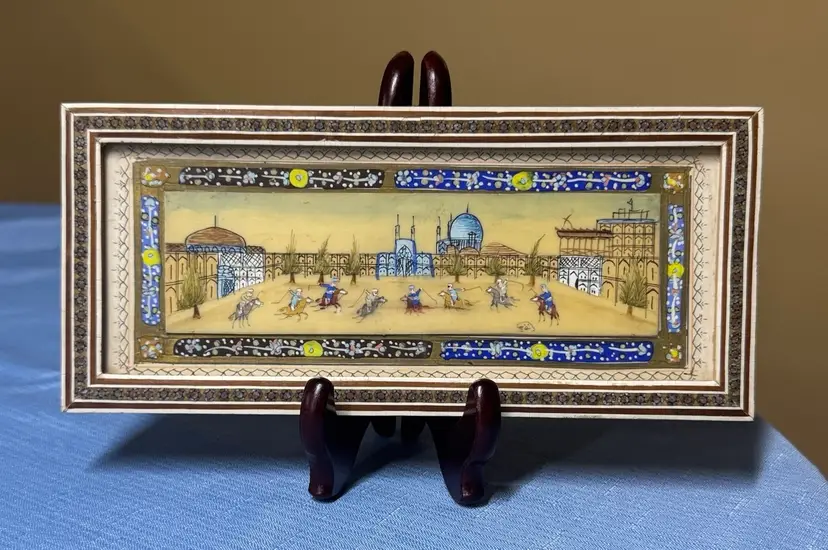 Persian painting on bone set in an inlaid Khatam frame 9 3/8” by 4 1/4”
