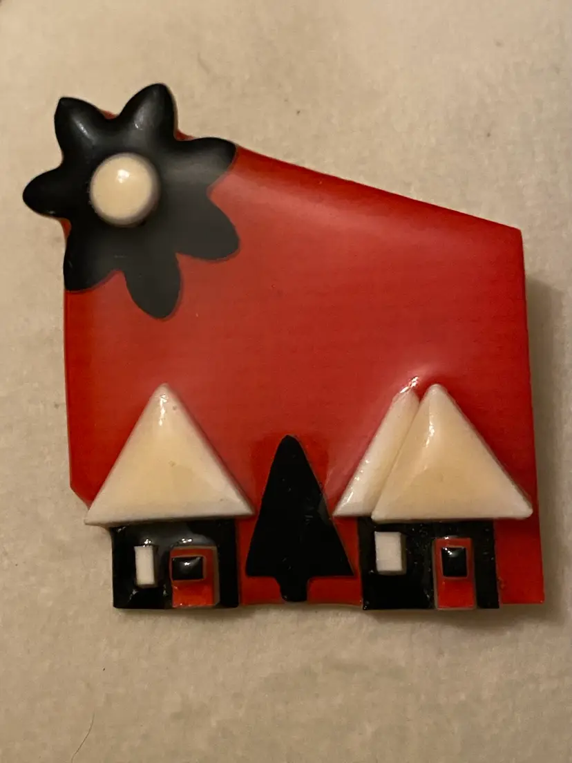 LUCINDA House Pin - Red Background With 3 Black And White Houses, And A Big Black Flower Instead Of A Sun