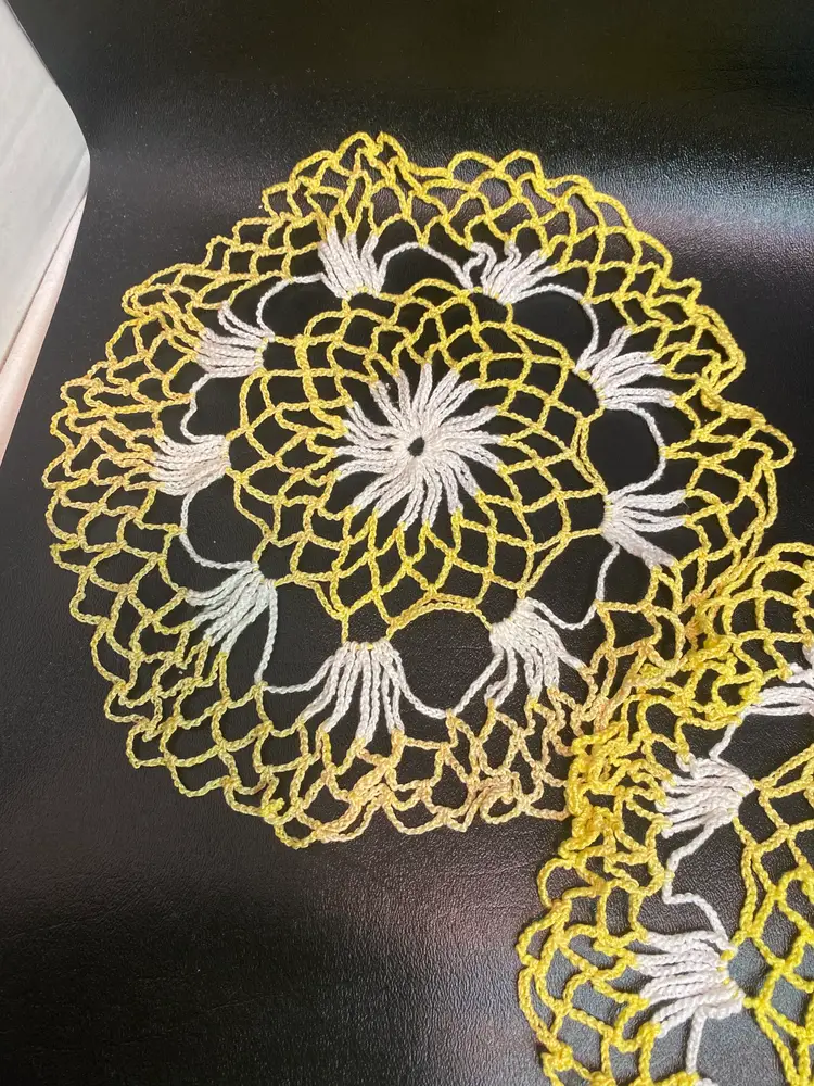 Vintage set of hand crocheted yellow and white doilies