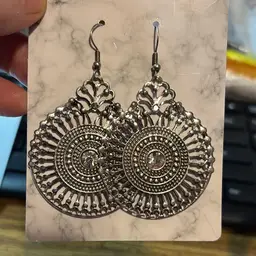 Silvertone Bohemian Style Earring With A Clear Rhinestone In The Middle Surrounded By Filigree