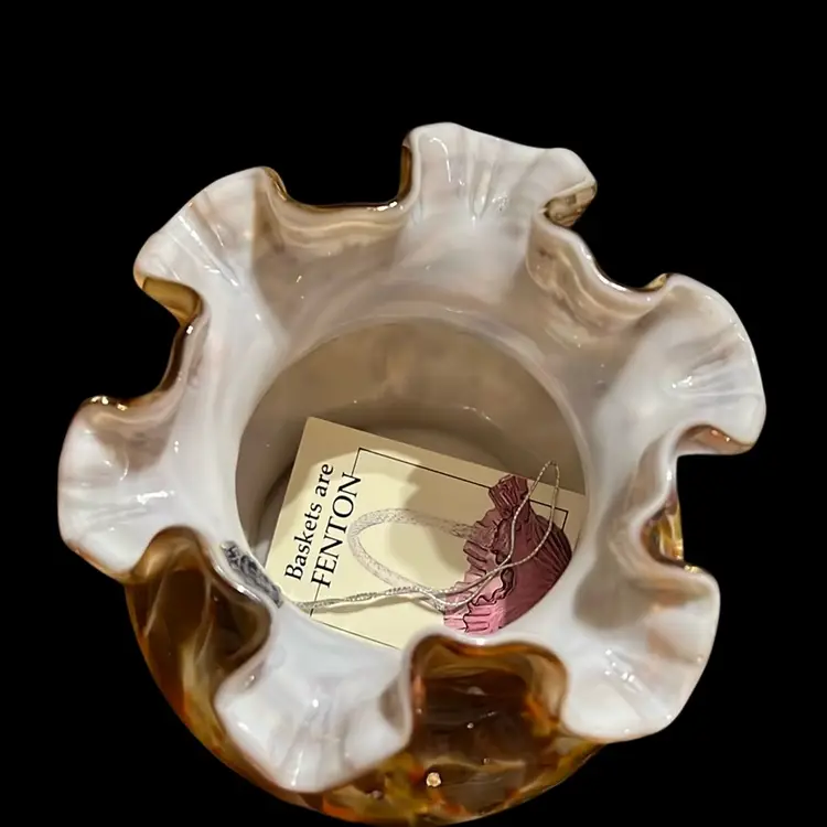A vintage Fenton Murrhina art glass vase with a ruffled rim.