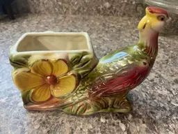 Hull Pottery #61 pheasant planter with a floral design.