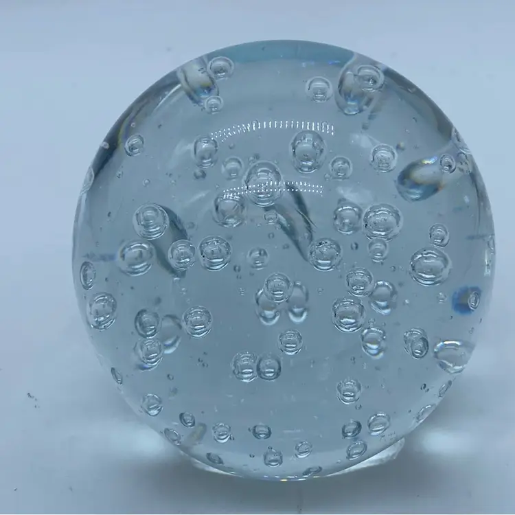 #0042 Clear glass paperweight with trapped bullicante bubbles.