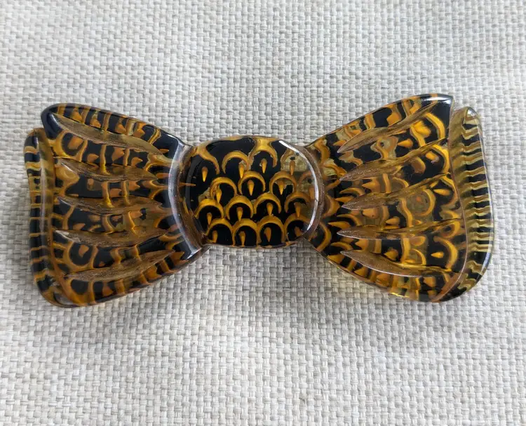 Bakelite Apple Juice Bow Brooch with Reverse Carving and Painting