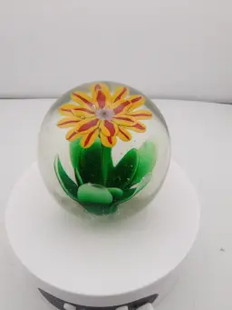 Orange and yellow flower paperweight