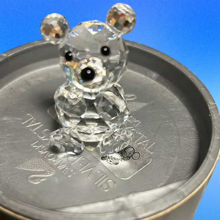 A faceted crystal teddy bear figurine by Swarovski with original packaging. Great Christmas Gift Idea