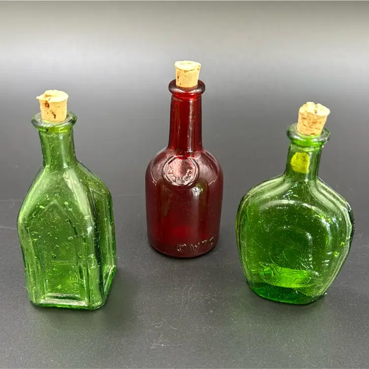 A Set Of 3 Little Bottles