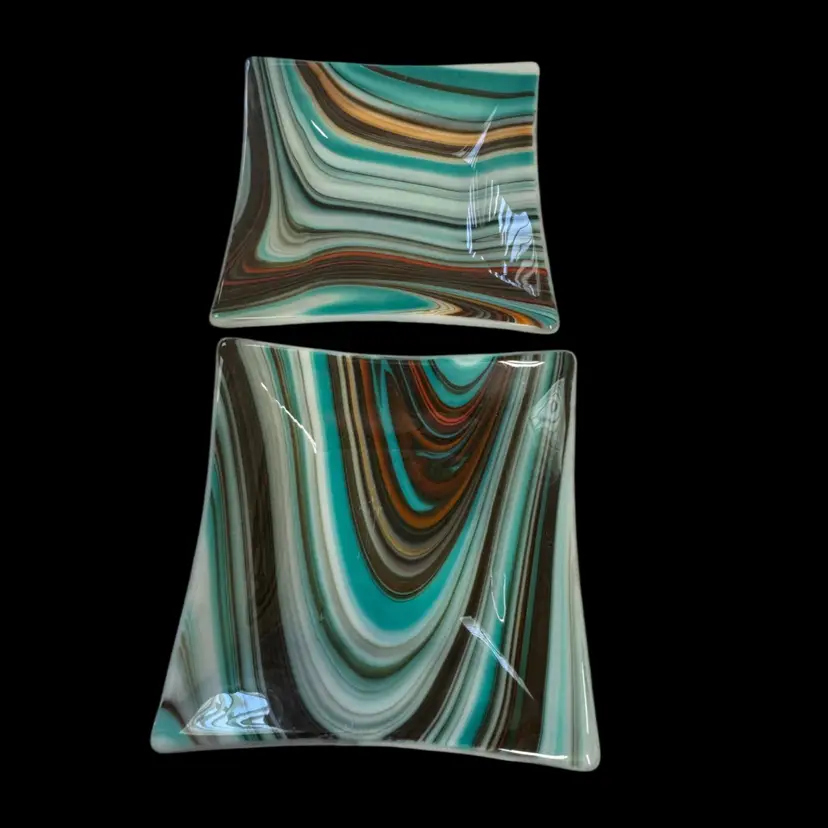 Pair of square fused glass dishes with swirled turquoise, brown, and orange patterns.