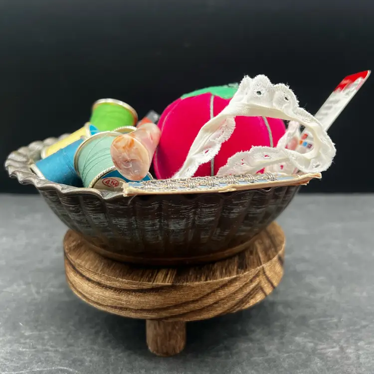 #184A Beautiful Vintage Hammered Copper Ribbed Bowl Filled With Vintage Sewing Notions. Spools Of Thread, Lace Remnant, A Pincushion, Pack Of Needles, Measuring Tape, Pattern Tracing Tool, Etc.