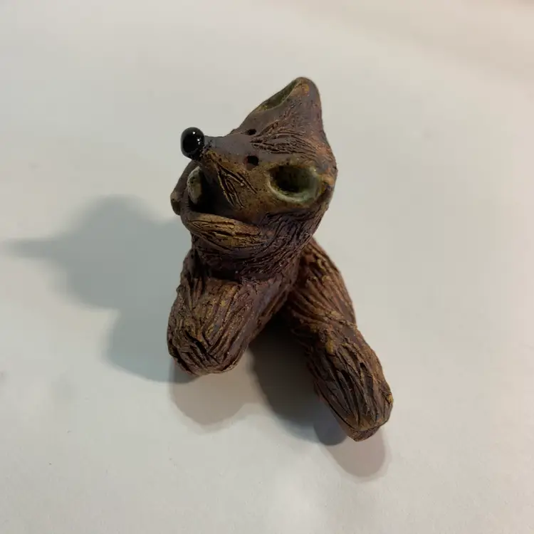 Art Pottery Raccoon on a Log
