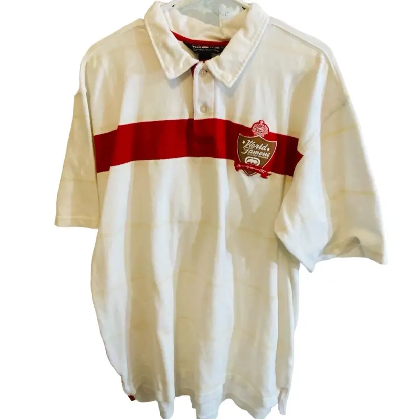 Ecko UNLTD Polo Striped With Light Brown, Tan, Red, And White Stripes. White Color Collard. Embroidered Logo. Size XL