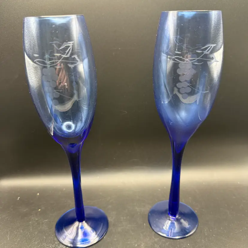 A Pair Of Vintage Blue Etched Champagne Flutes