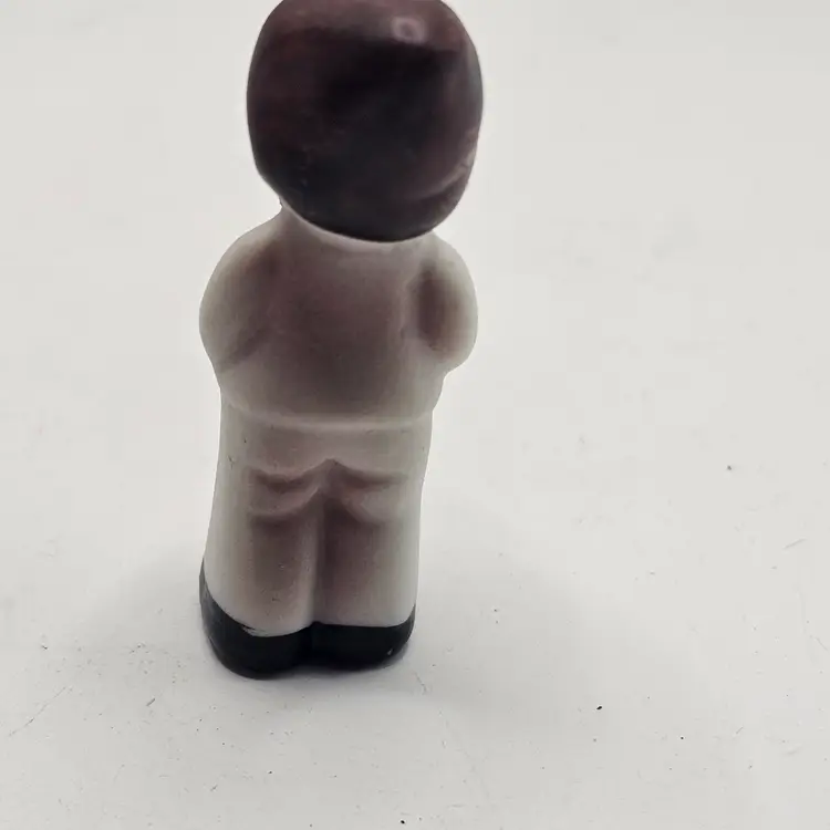 Porcelain Figurine Miniature boy with flowers