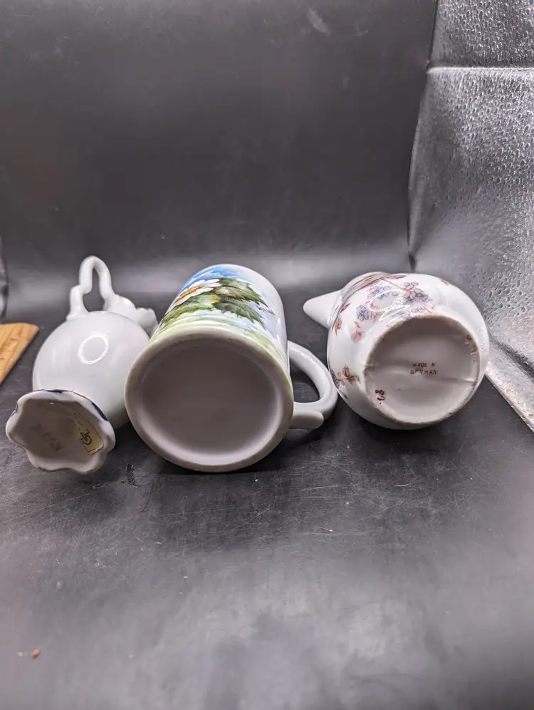 Vintage Lot of 3 Porcelain Pieces Two Creamers and One Cup.