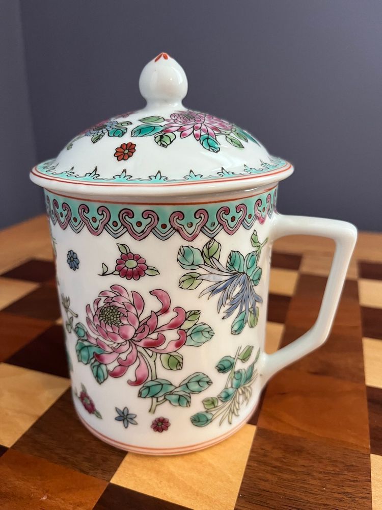 Vintage   porcelain mug with lid, likely of Chinese origin, possibly in the style of Rose Medallion or Famille Rose.