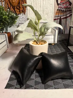 Flower And Two Black Leather Pillows