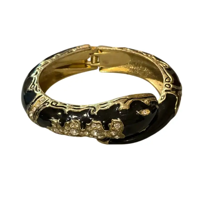 Cuff Clamper Of Gold Tone And Black Snake