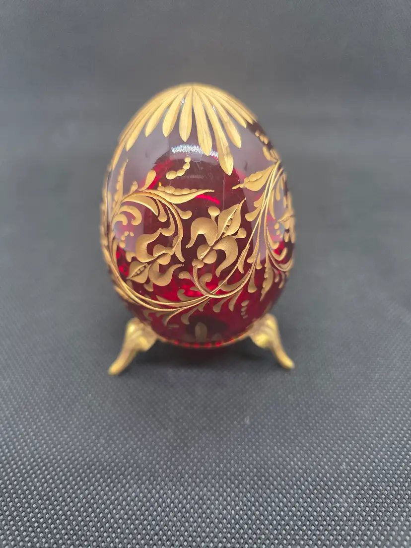 Vintage ruby red cut to gold glass fabriget egg with metal ring stand
