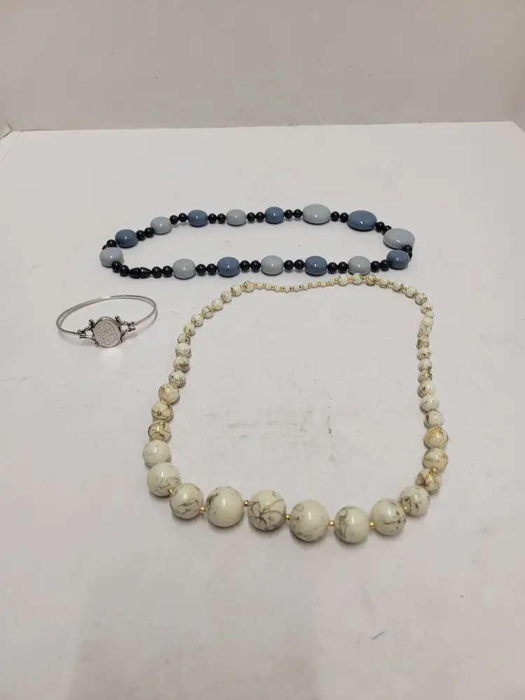 2 necklaces and a bracelet