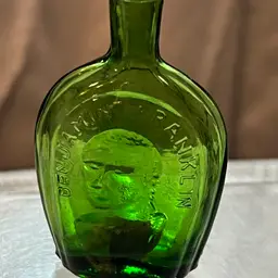 040 Wheaton Green Glass Bottle, Benjamin Franklin 3" X 2"