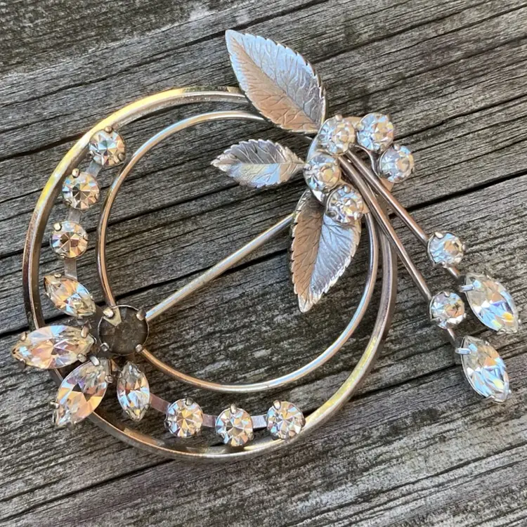 Silver tone Krementz brooch   With A Black rhinestone, White Rhinestones and leaves