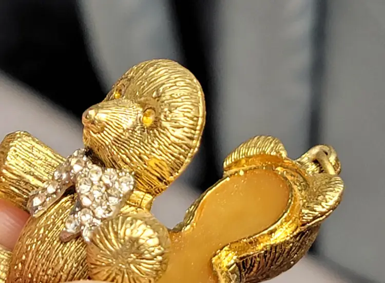 Max Factor brushed goldtone bear perfume pendant