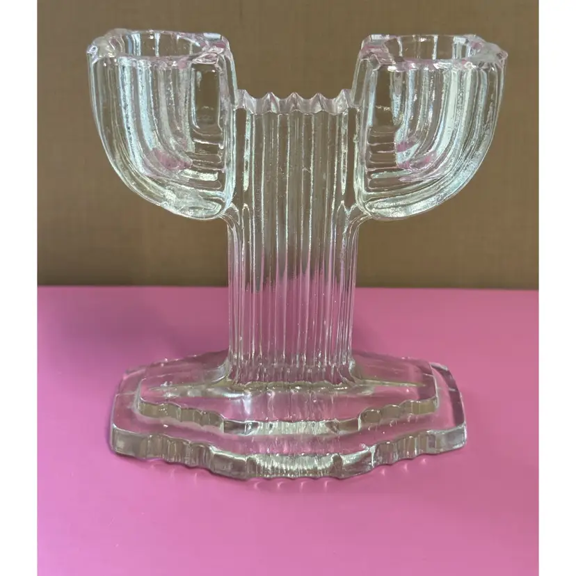 Clear glass Art Deco ribbed candlestick holder, possibly cactus-shaped.