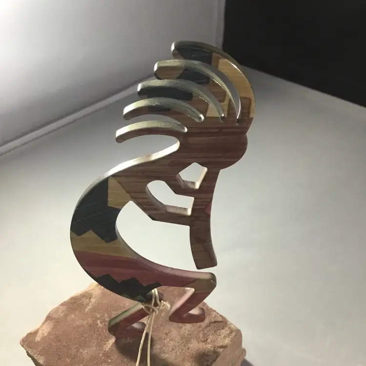 Kokopelli metal on stone base