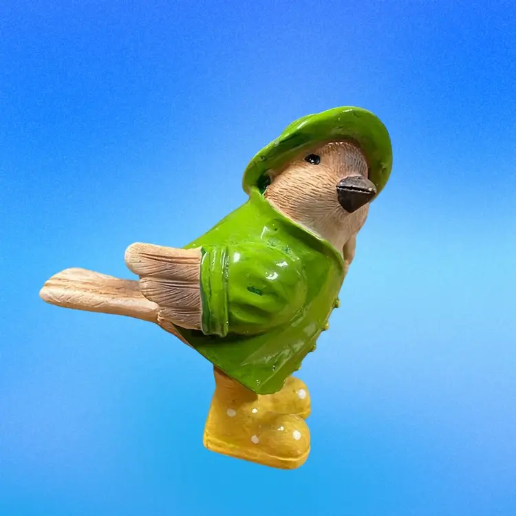 Small Ceramic Bird Wearing Green Slicker
